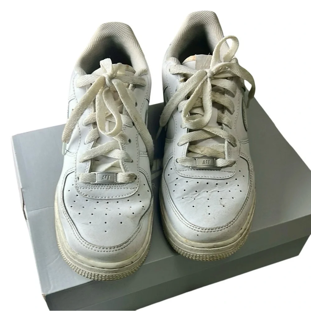 Nike White Sneakers with Perforated Design and Cushioned Midsole